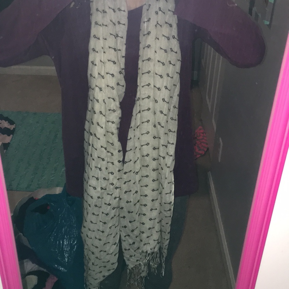 White scarf. With black design.